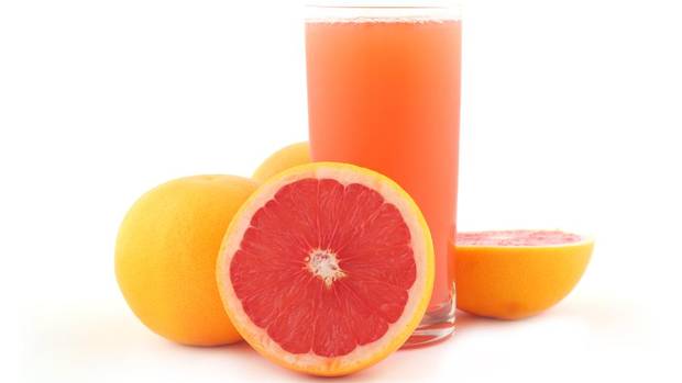 grapefruit half and glass of juice